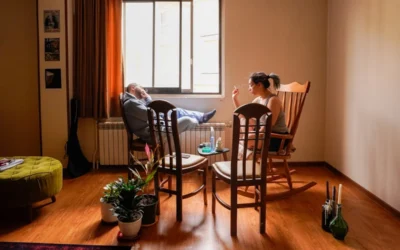 People relax in a cozy living room setting.
