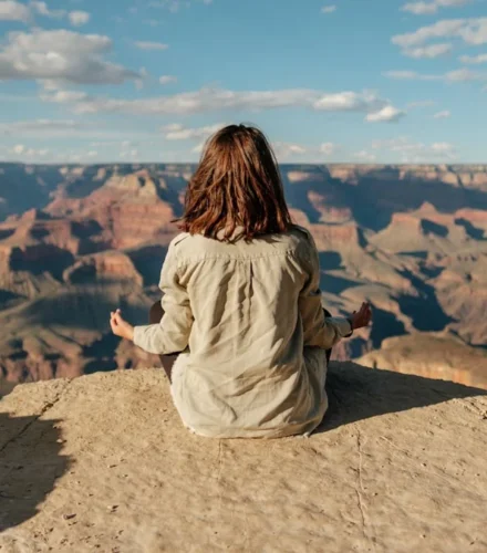 woman sitting on hill