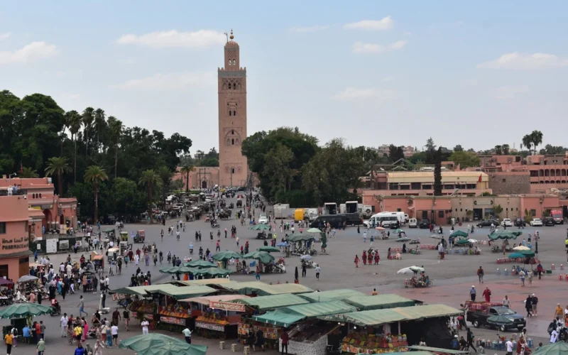 a large crowd of people in a city square