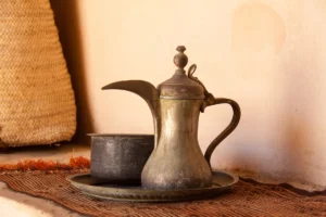 a teapot and a cup on a table
