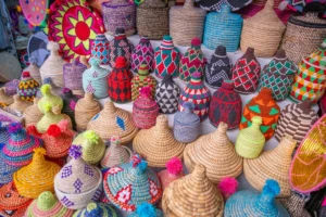 Colorful woven baskets and containers at a market.