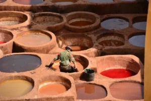 A box filled with lots of different colored paints