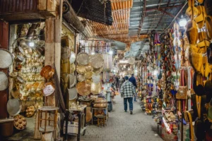 Bustling marketplace filled with various goods and shoppers