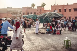 a group of people standing and sitting in a courtyard