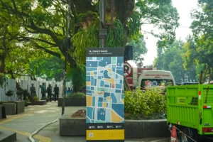 Street map sign with colorful blocks and trees.