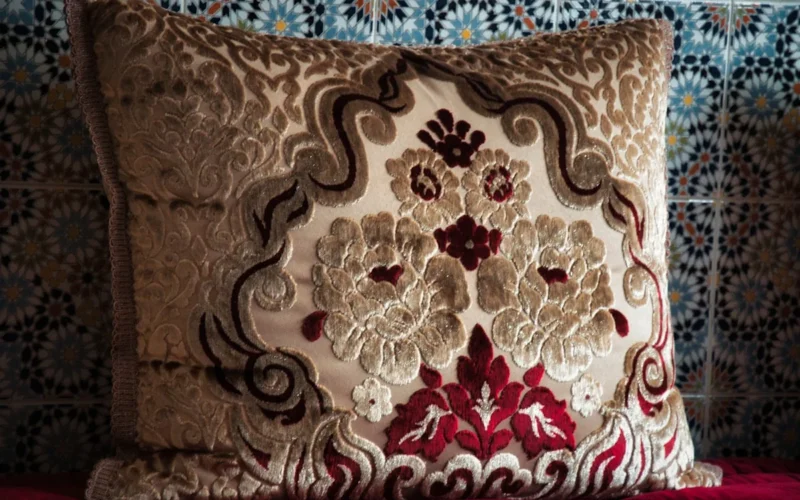 brown and white floral throw pillow