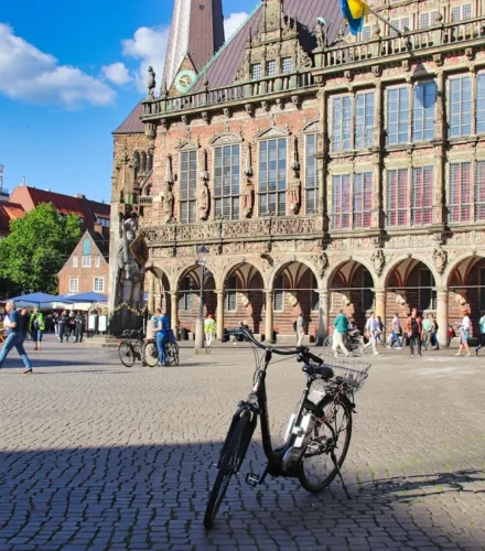 a bicycle is parked in front of a building