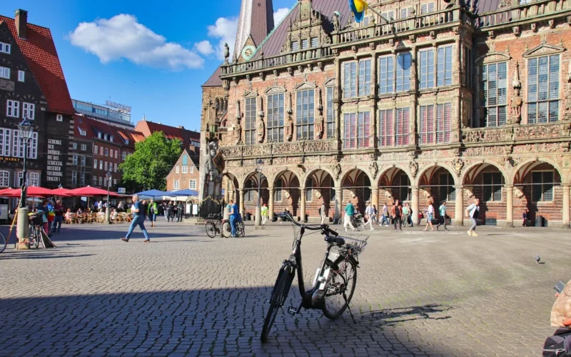 a bicycle is parked in front of a building