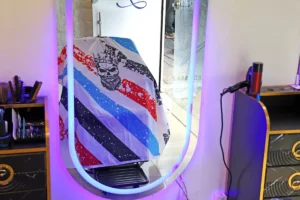 A barbershop cape with a creative and eye-catching design, located in a men's barbershop in Tehran.