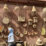 Wall where handmade goods like baskets where presented for selling in Marrakech Médina.