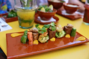 a plate of food on a yellow table
