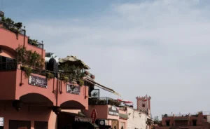 Pink buildings stand against a bright, clear sky.