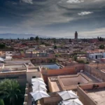 a view of a city with a clock tower in the distance