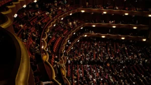 Audience waiting, seated, in a theatre, opera house in New York.