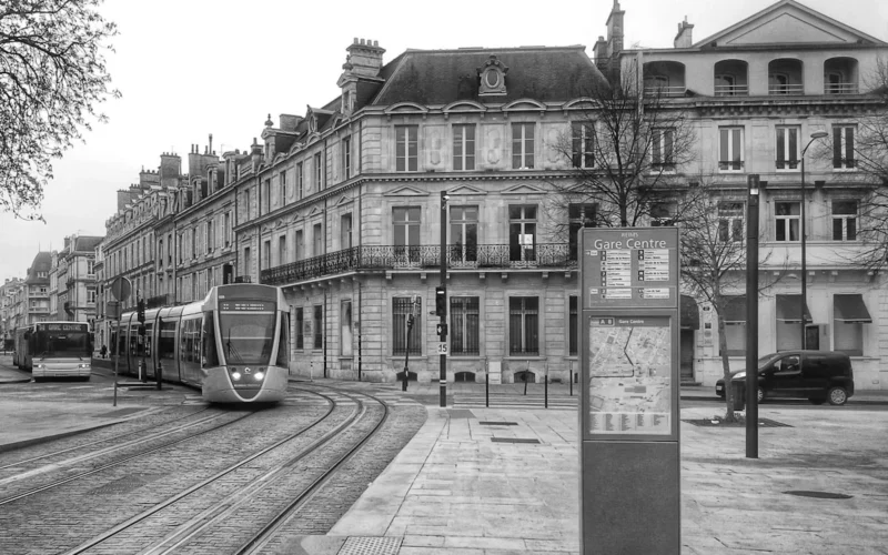 a black and white photo of a train on the tracks