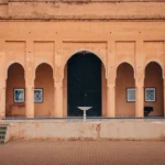 Courtyard with arched doorways and framed art