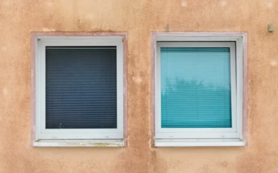 Two windows on a textured wall