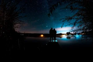 Couple on the pier at night