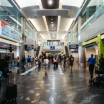 a group of people walking through an airport