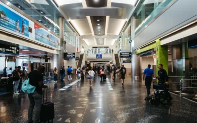 a group of people walking through an airport
