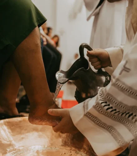 a close up of a person pouring something into a bowl