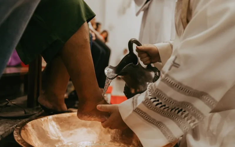 a close up of a person pouring something into a bowl