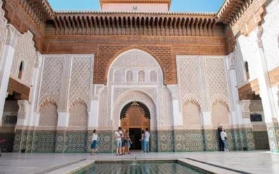 A group of people standing around a pool in a building