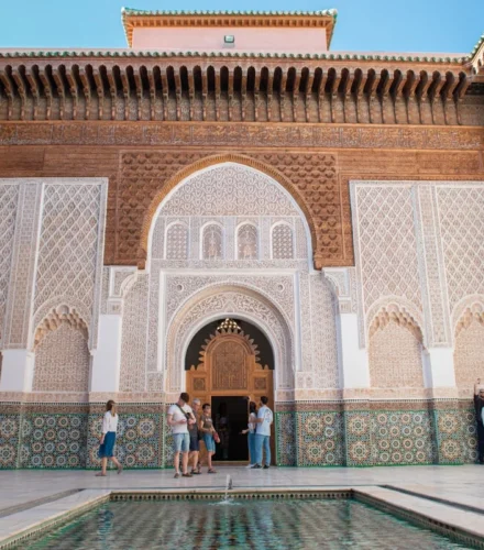 A group of people standing around a pool in a building