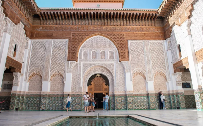 A group of people standing around a pool in a building