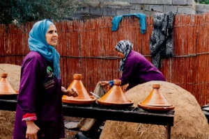 woman in green hijab standing beside woman in purple hijab