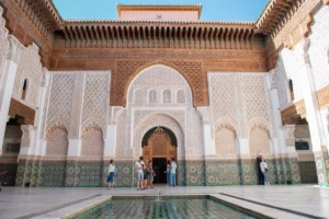 A group of people standing around a pool in a building
